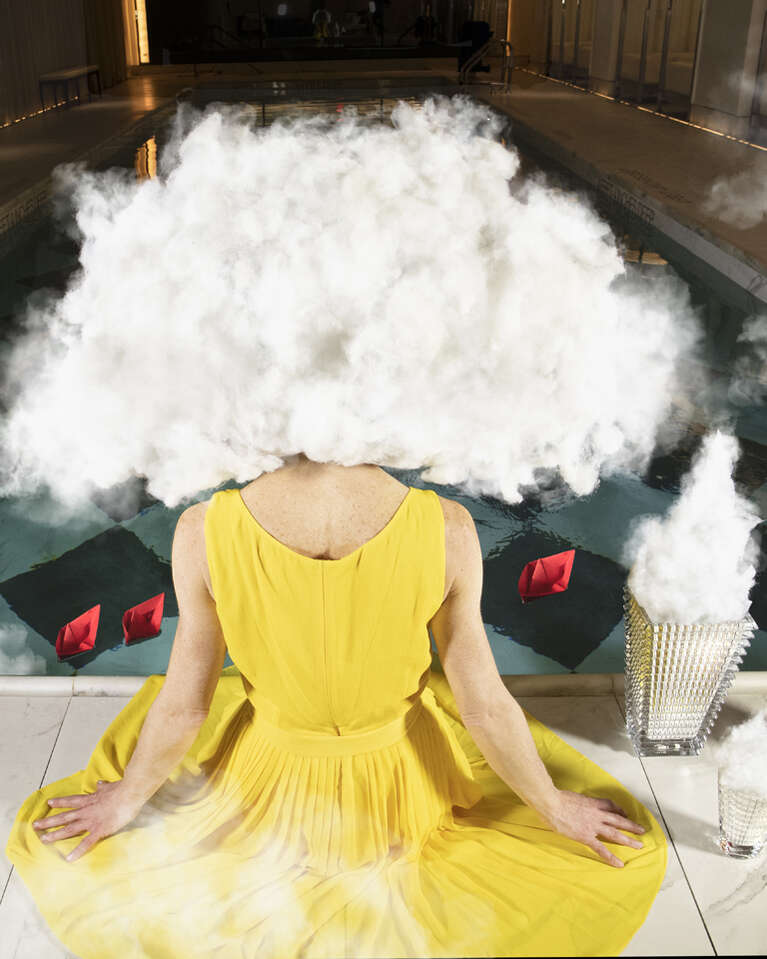 Woman with yellow dress, clouds on her head, vases