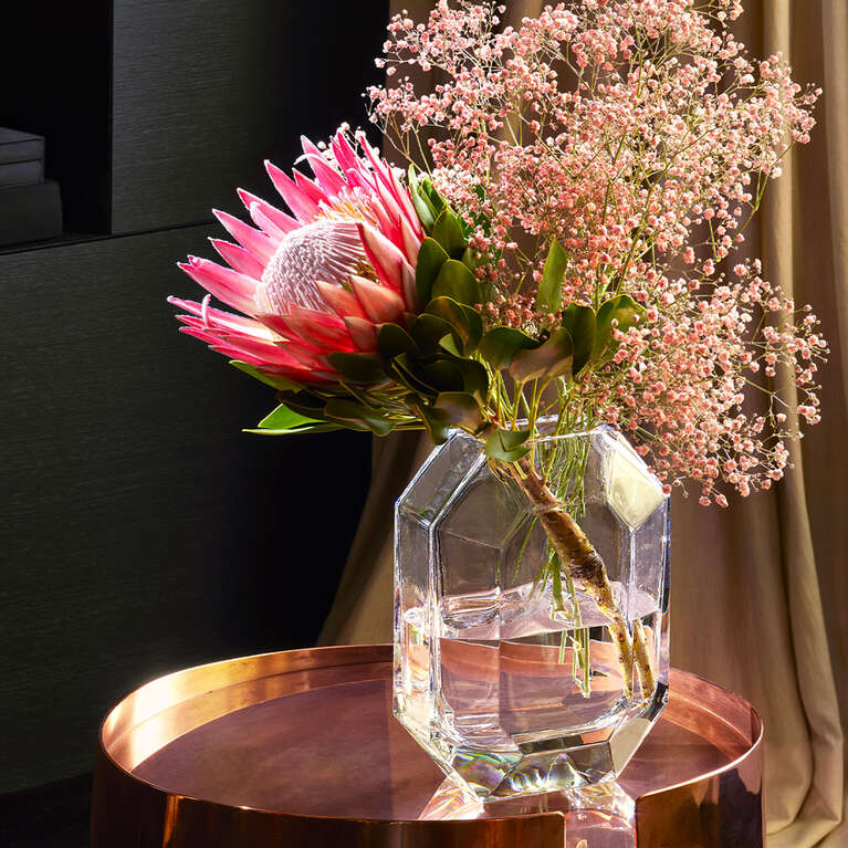 Octogone clear vase with flower arrangement