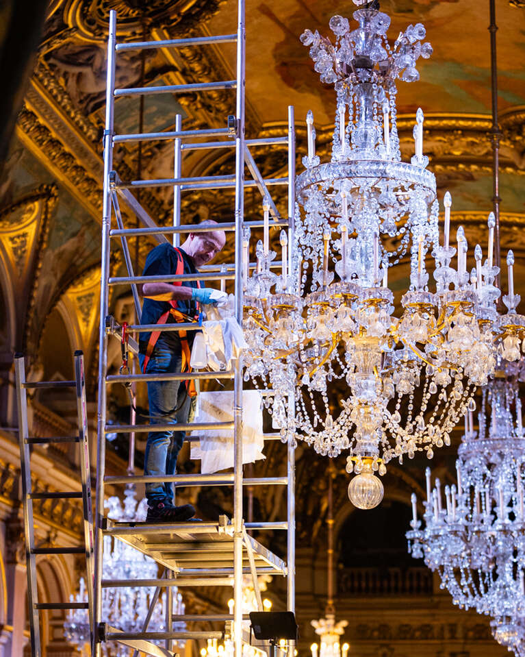 The Hotel de Ville - The Paris City Hall installing a chandelier